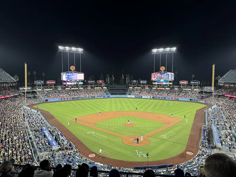 Dodger Stadium at night, lights on and the stands full